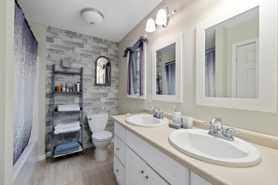 Modern designed restroom with white painted walls and lavatories